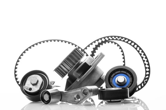 kit of timing belt with rollers on a white background