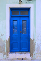 Fototapeta premium Blue Door with Evil eyes charms in Kastellorizo,Greece