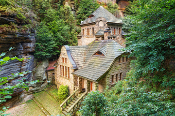 Obraz premium .Mystical house in the Czech town of Hrensko. Czech Saxon Switzerland. Czech Republic.