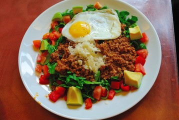Ground pork, chopped tomatoes, avocado and spinach with Parmesan and fried organic egg over rise (berlin nov 2018)
