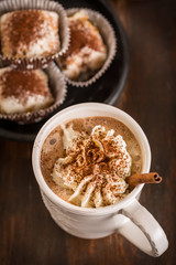 Christmas hot chocolate with whipped cream and cookies