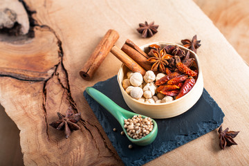 Exotic herbal Food concept Mix of the organic Spices cinnamon stick, cardamom pods, chili, star...