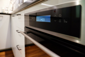 Pan on modern black induction cooker, hob, hob or built-in hob with ceramic top in white kitchen...