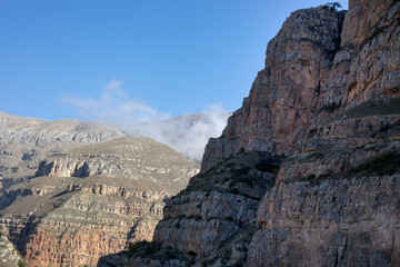 Cycling mountain road. Misty mountain road in high mountains.. Cloudy sky with mountain road. Summertime