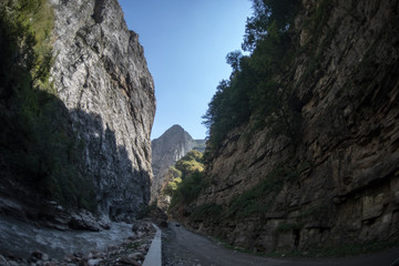 Cycling mountain road. Misty mountain road in high mountains.. Cloudy sky with mountain road. Summertime