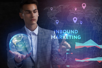 The concept of business, technology, the Internet and the network. A young entrepreneur working on a virtual screen of the future and sees the inscription: Inbound marketing