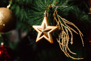 Christmas toy on the Christmas tree. Decorated Christmas tree ball. Christmas ball close up. Selective focus.