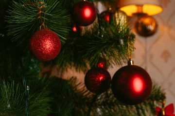 Christmas toy on the Christmas tree. Decorated Christmas tree ball. Christmas ball close up. Selective focus.