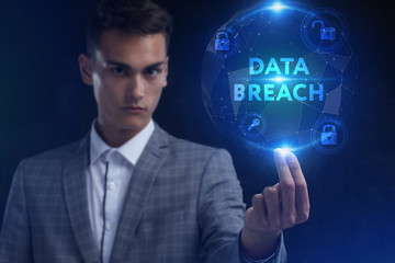 The concept of business, technology, the Internet and the network. A young entrepreneur working on a virtual screen of the future and sees the inscription: Data breach