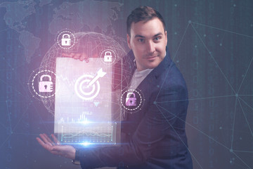 The concept of business, technology, the Internet and the network. A young entrepreneur working on...