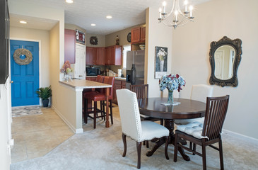 Condo Dining Area, Kitchen & Entrance with Blue Door