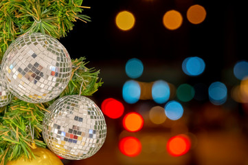 Glass ball ornaments on a Christmas tree and blurred lights. with clipping path.