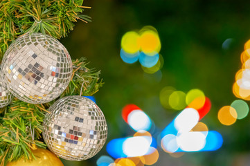 Glass ball ornaments on a Christmas tree and blurred lights. with clipping path.