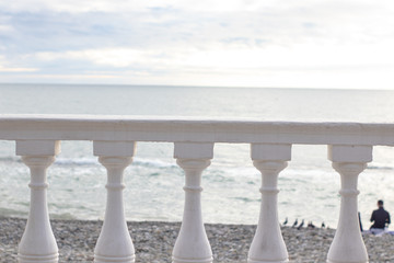 White parapet on the seafront overlooking the sea