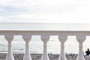 Fototapeta premium White parapet on the seafront overlooking the sea