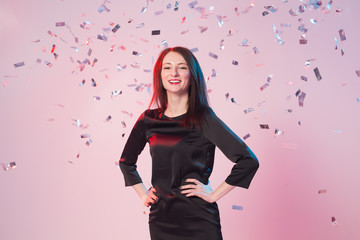 New Year, Saint Valentine's day and holidays concept - Cheerful young woman have fun while confetti...