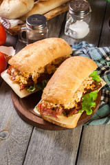 Ciabatta sandwich with smoked bacon and eggs