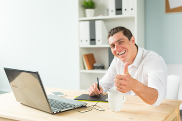 Business, humor and people concept - Young graphic designer man in white shirt gesture thumb up