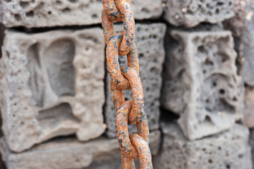 Closeup rusty chain link. Closely and inseparably connected