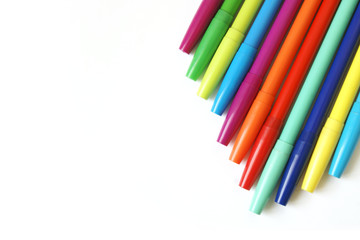 Fototapeta premium Top View of Colorful Markers on White Background