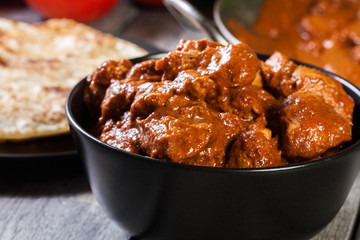 Chicken tikka masala served with bread naan
