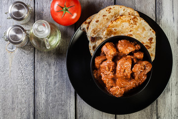 Chicken tikka masala served with bread naan