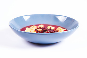 Traditional polish Christmas Eve dish: red borscht with uszka (a mushroom filled kind of dumplings)