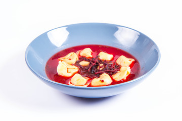 Traditional polish Christmas Eve dish: red borscht with uszka (a mushroom filled kind of dumplings)