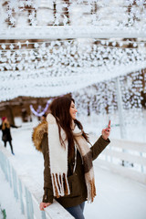 Fototapeta na wymiar Young woman in winter park