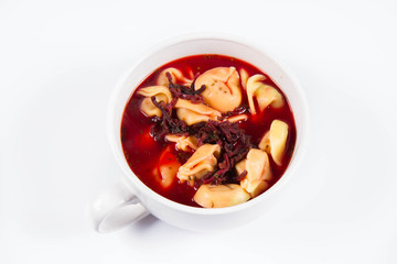 Traditional polish Christmas Eve dish: red borscht with uszka (a mushroom filled kind of dumplings)