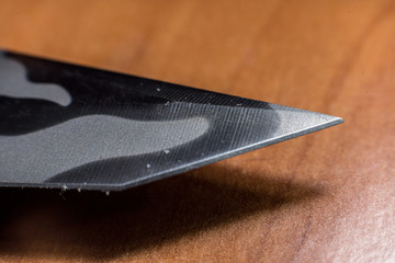 Blade of a military knife, macro photo