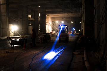 Folklift in the construction site or factory. this site is in underground (Low light)