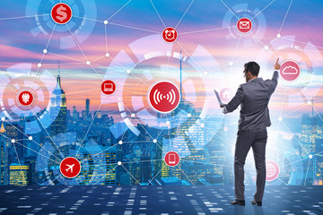 Concept of smart city with businessman pressing buttons