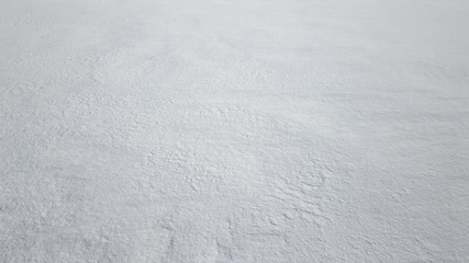 Low level flight over fresh white snow
