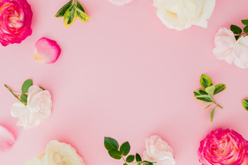 Floral composition with white and red roses flowers on pink background. Flat lay, top view.