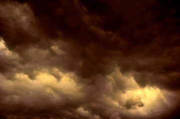 RED AND GOLD DARK THUNDERY STORM CLOUDS IN SKY