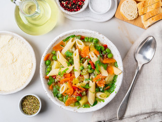 Minestrone soup, Italian cuisine. Vegetarian soup with vegetables, Penne paste, cheese. White...