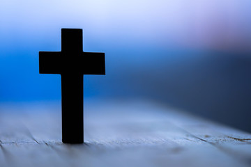 cross in wooden background