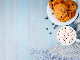Chocolate chip cookies with cocoa, marshmallow. Cozy evening, cup of drink, copy space.