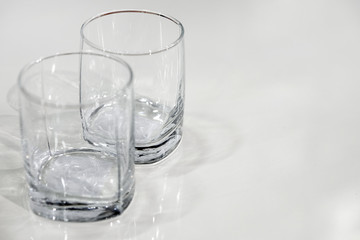 two empty glasses. close-up view from above. the empty surface of the table