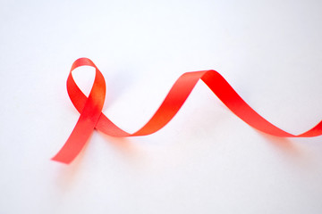 Obraz na płótnie Canvas Red ribbon with World Aids day concept.