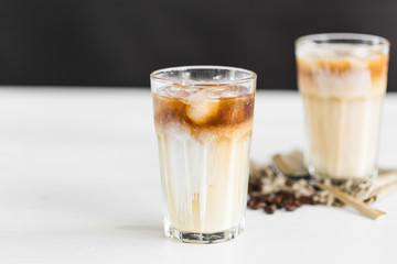 Delicious drink concept - Iced coffee in a glass with ice.