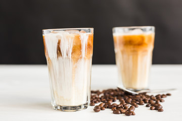 Delicious drink concept - Iced coffee in a glass with ice.