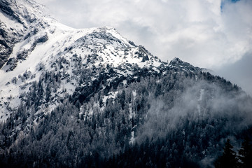 mountain peak in snow on a cloudy day