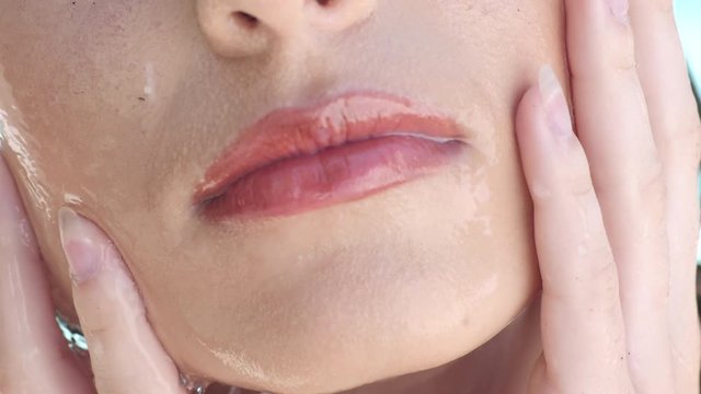 woman face with make-up detail with pouring water