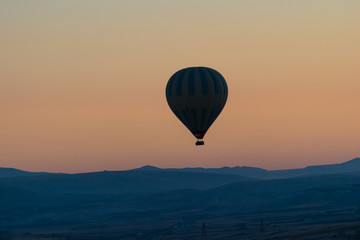 Cappadocia hot air balloon in the sky at sunrise sillouette