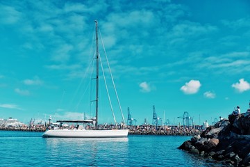 sailing boats are leaving the city marina for the atlantic crossing regatta race ARC 2018 on a sunny day