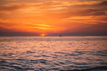 Warm beautiful evening sunset above sea, Cleopatra's beach in Alanya, Turkey