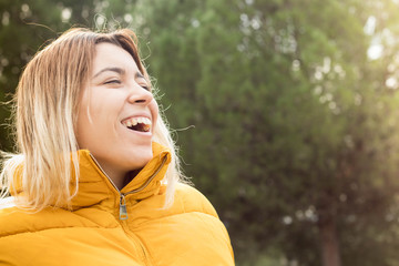 pretty young girl with a smile in the field in autumn