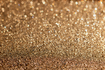 Shiny Golden abstract background with bokeh